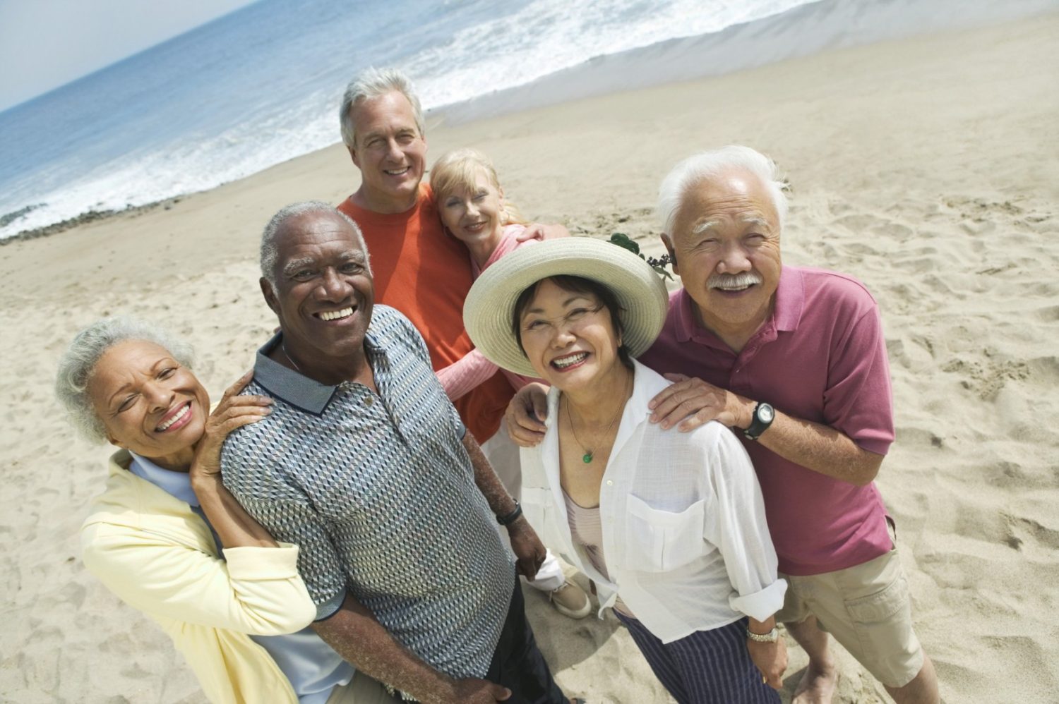 multi-ethnic group of seniors on the beach, older adults