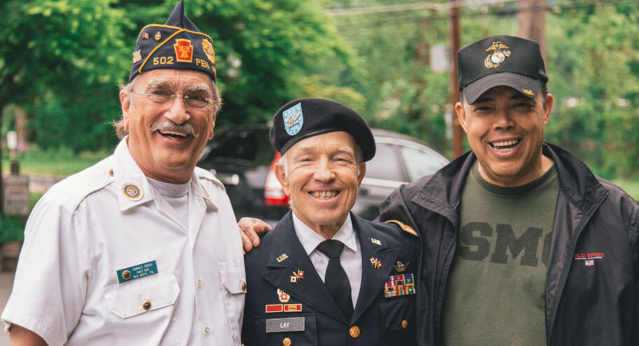 three veterans standing for a picture